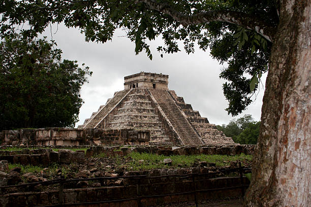 Discovering the Mayan Pyramid at Chichen Itza, Mexico Entering the clearing at Chichen-Itza Mexico to discover the pyramids maya temple stock pictures, royalty-free photos & images