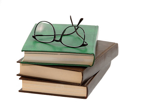 istock pile of books and eyeglasses 92024080