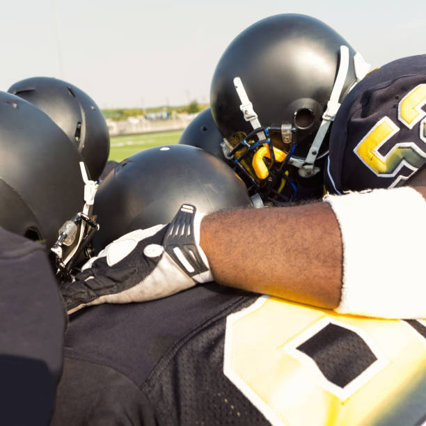 istock Football players huddle up during time out 920247840