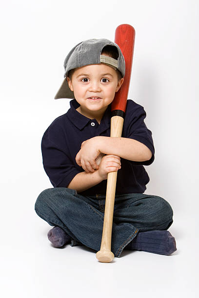 Boy with baseball bat  back to front stock pictures, royalty-free photos & images