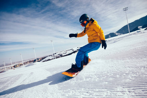 istock one snowboarder snowboarding in winter mountains 920252486