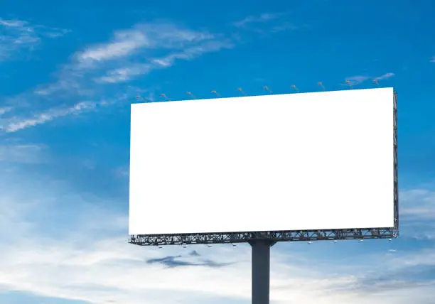 Blank billboard with a background of sky. With clipping path on screen - can be used for trade shows, and advertising or promotional poster for you.