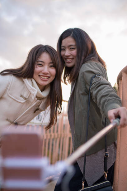 istock Young sisters taking selfie picture together at observatory 920255450