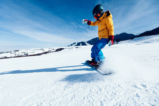 istock one snowboarder snowboarding in winter mountains 920257932