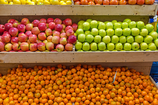 Mandarins and apples for sale at a market in Chile