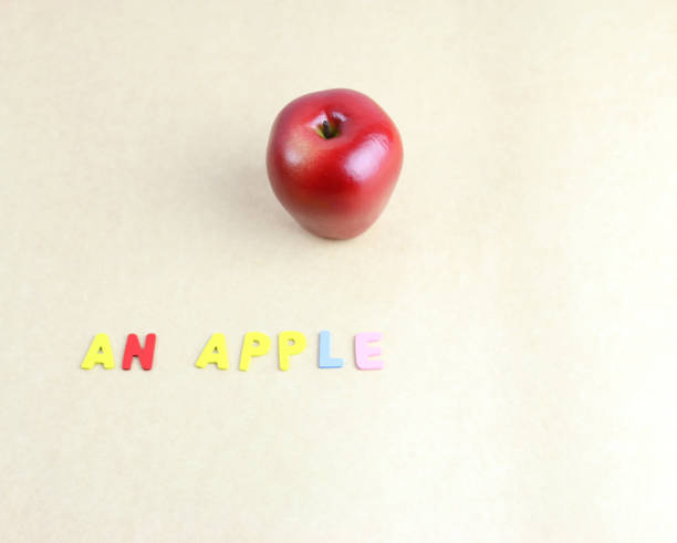 istock An red apple with alphabet on brown paper. 920260470