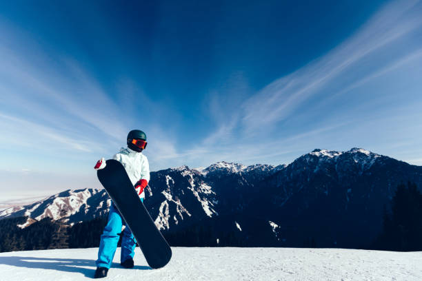 istock one snowboarder with snowboard on winter mountain top 920260512