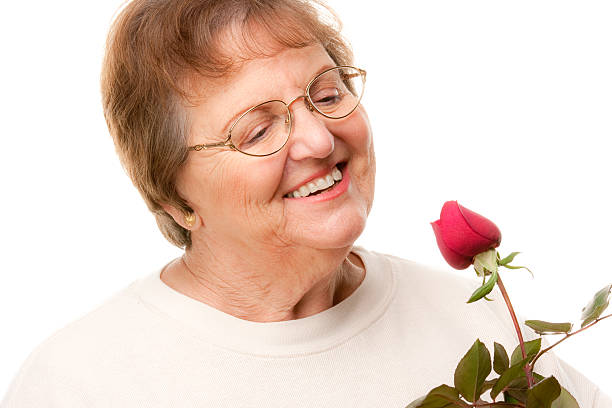 istock Attractive Senior Woman with Red Rose 92026753