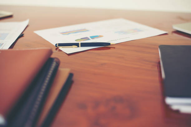 istock business documents with charts growth,and pen,workplace business. 920273122