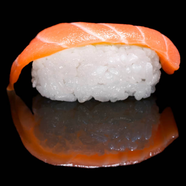 istock Salmon sushi isolated on black background 920275990
