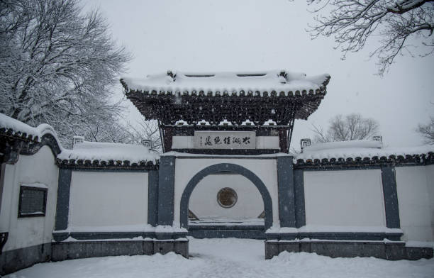 Snow scenery at the entrance of Turtle Head Islet Park in Wuxi. Wuxi, Jiangsu, China - January 27, 2018: Snow scenery at the entrance of Turtle Head Islet Park in Wuxi. lake tai stock pictures, royalty-free photos & images