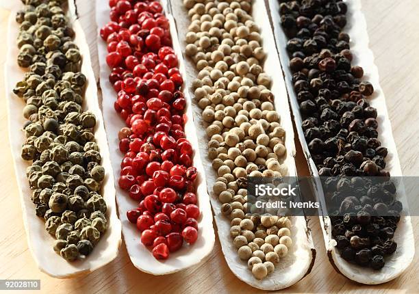 Peppercorns Spices In The Sea Shells On Wood Stock Photo - Download Image Now - Animal Shell, Black Color, Black Peppercorn