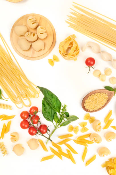 istock Overhead photo of different types of pasta on white, forming frame 920281114