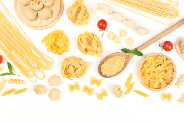 istock Overhead photo of different types of pasta on white with copy space 920281220