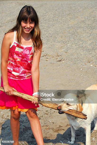 Girl Play Dog Stock Photo - Download Image Now - Animal, Beach, Beautiful People