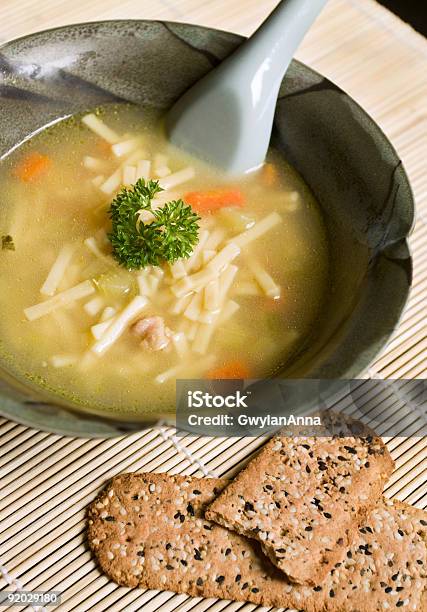 Chicken Noodle Soup With Sprig Of Parsley Stock Photo - Download Image Now - Chicken Noodle Soup, Bowl, Chicken Soup