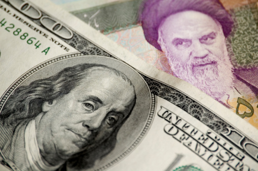 American money(100 dollars) and iranian money(50 000 rials)