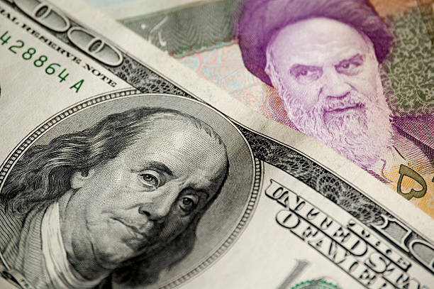 Different currencies, same value  American money(100 dollars) and iranian money(50 000 rials) iranian ethnicity stock pictures, royalty-free photos & images