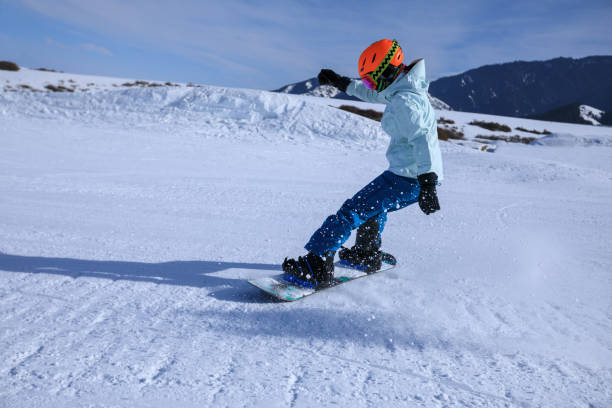 istock one snowboarder snowboarding in winter mountains 920297288