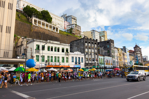 Salvador Bahia: People are waiting on the long line to take the Elevator Lacerda for free, because of the Carnival to get the historic center on the top of the city.