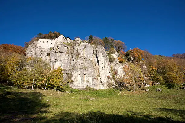 Sanctuary of La Verna is Situated in a defensive place on the steep southern wall of Mt. Penna, the famous Franciscan sanctuary has always been a destination for pilgrims: it lies within a silent and gloomy wood where the Saint spent most of his hermit's life. Tuscany. Italy