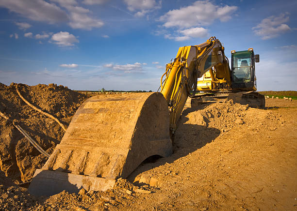 Dirty yellow excavator  road scraper stock pictures, royalty-free photos & images
