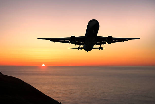 istock Airliner landing at sunrise 92030585