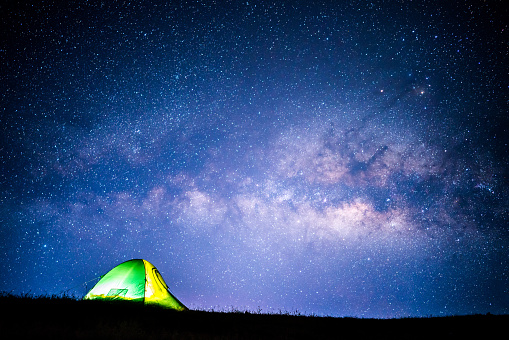 Camping, tent under the Milky way background, Thailand.