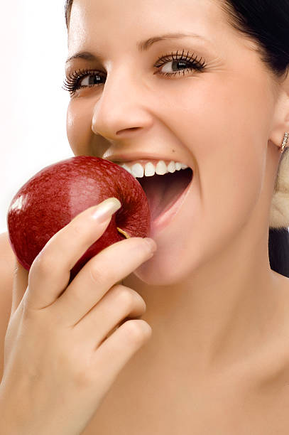 istock Young woman eating apple 92030891