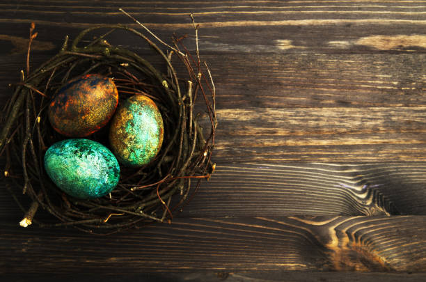 istock Easter eggs on a wooden background .Easter eggs of different colors .Easter eggs top view 920309482
