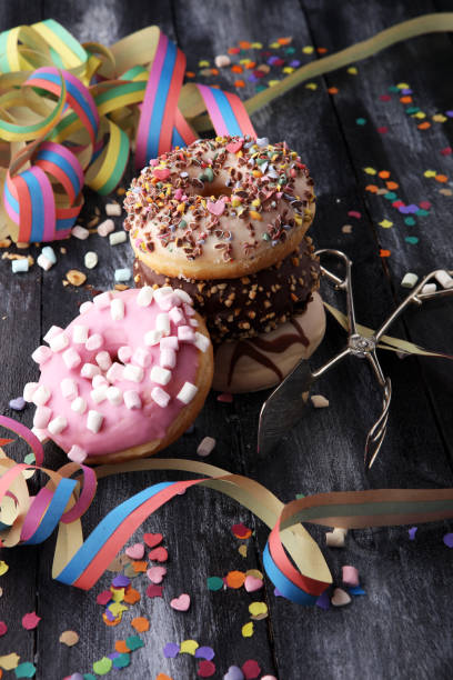 istock assorted donuts with chocolate frosted, pink glazed and sprinkles donuts. 920309558