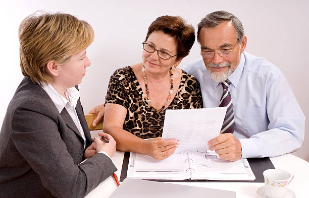 istock A financial planner meeting with an elderly couple 92031594