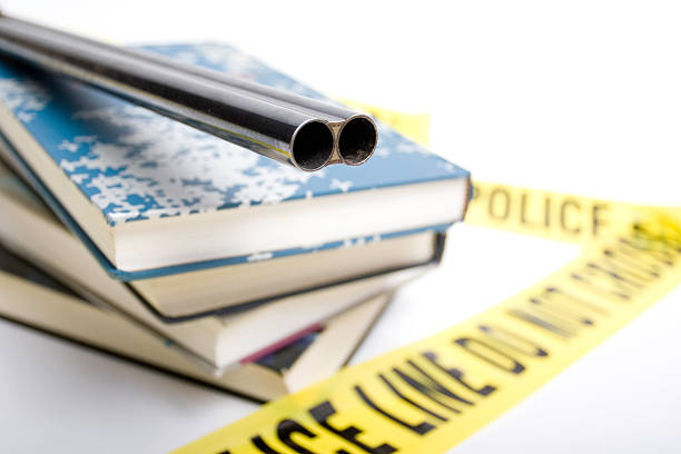 School Violence shotgun on top of schoolbooks stock photo