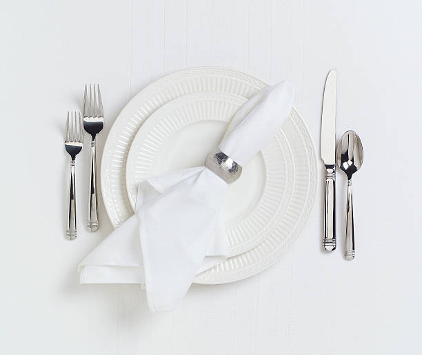 istock Elegant white dinner placesetting on white linen tablecloth 92032168