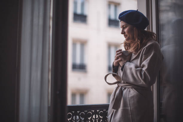 istock Woman drinking coffee at the balcony 920322346