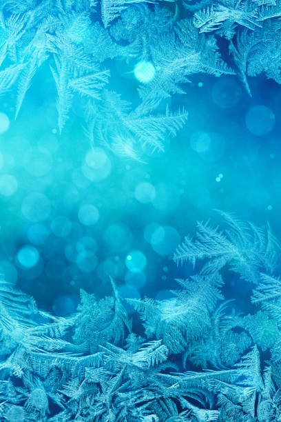 istock Defocused blue background with ice flowers 920329500
