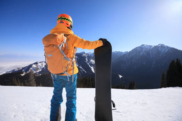 istock one snowboarder with snowboard on winter mountain top 920332208