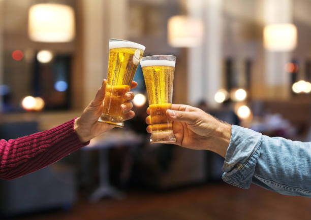 istock Beer glasses raised in a toast. 920339180