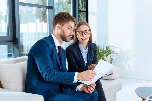 istock business people discussing papers 920339194