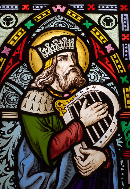 Stained glass depiction of the Biblical King David detail of victorian stained glass church window depicting King David, the author fo the psalms in the Old testament with a hand harp protestantism photos stock pictures, royalty-free photos & images