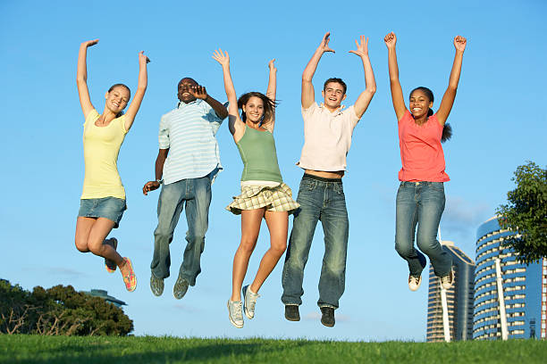 istock Group Of Teenagers Jumping 92034176
