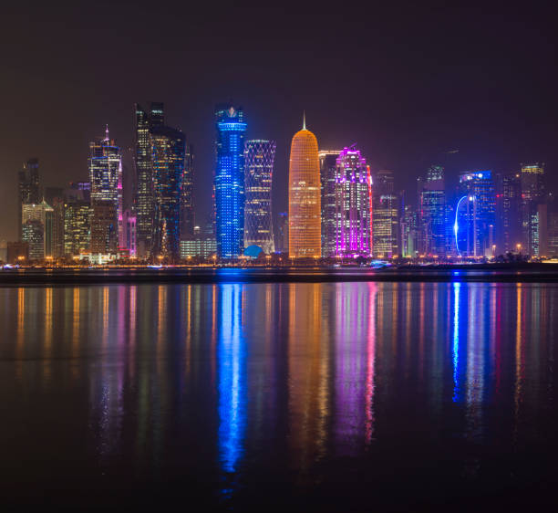 istock The Downtown Doha City Skyline with Reflection at Night, Qatar 920342750