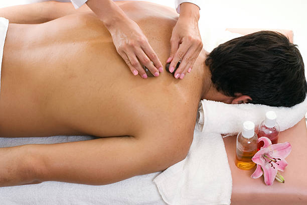 istock Man receiving thermal stone massage 92034800