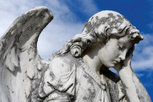 Close up of the angel statue on the tomb.