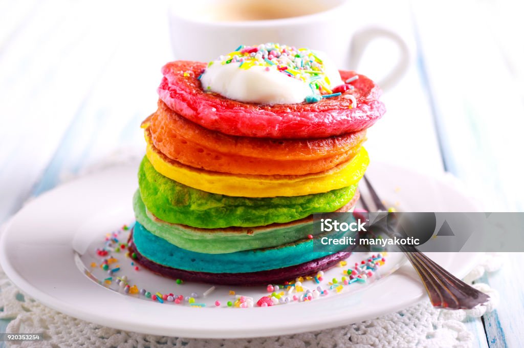 Rainbow pancakes, served in pile Rainbow pancakes, served in pile on plate Rainbow Stock Photo