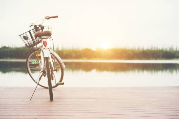 istock Vintage toned of bicycle with basket on empty pier, summer day. 920353724