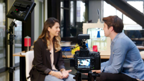 Reporter interviewing in a 3D printing office Reporter interviewing in a 3D printing office film studio photos stock pictures, royalty-free photos & images
