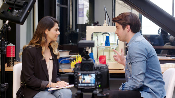istock Reporter interviewing in a 3D printing office 920357354