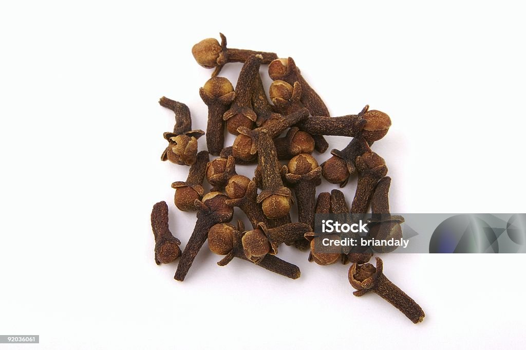 Cloves isolated on white  Brown Stock Photo