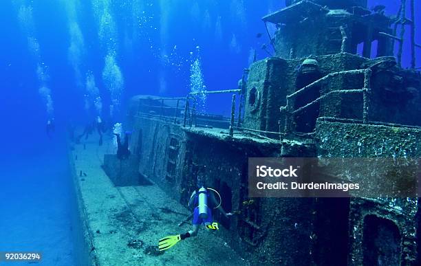 Scuba Divers Explore A Wreck Stock Photo - Download Image Now - Wreck Diving, Adventure, Color Image